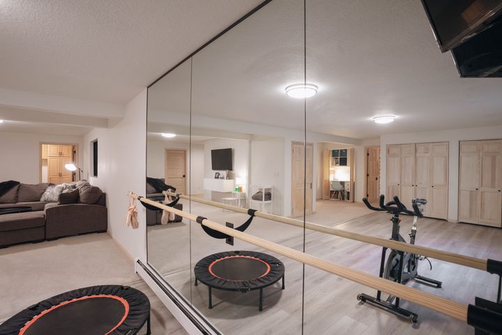 Workout studio with mirrors and ballet barre